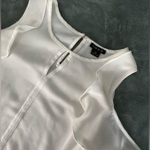 a pretty white blouse with a unique sleeve!